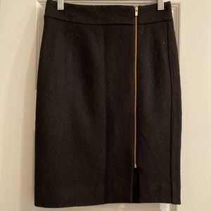 Banana Republic size 0P black lined with bold gold zipper style.